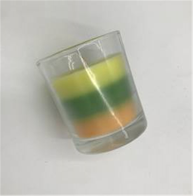 Bougie parfumée posée colorée de solide de paraffine de gradient de maison d'arome